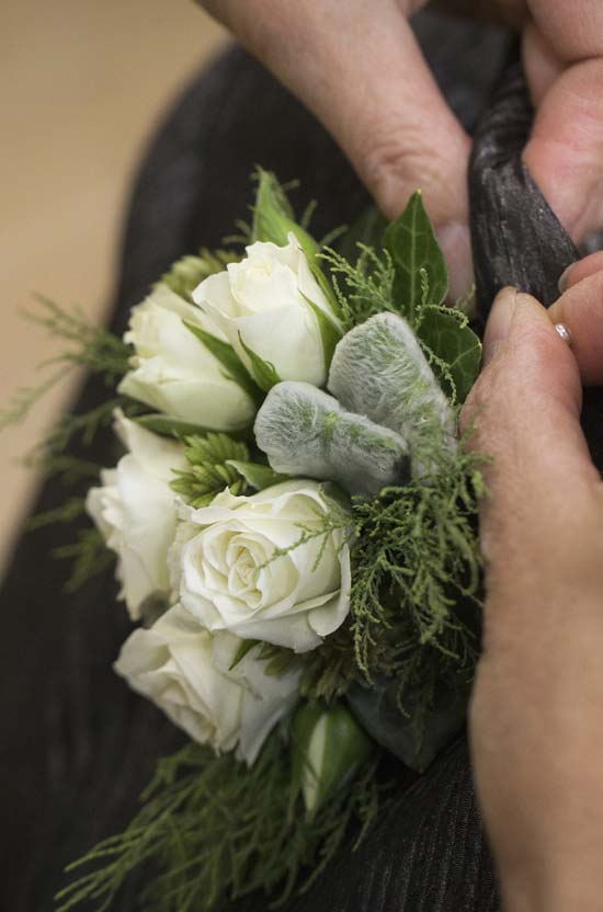 Pinning mum's buttonhole